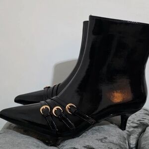Elegant Black Ankle Boots with Gold Accents